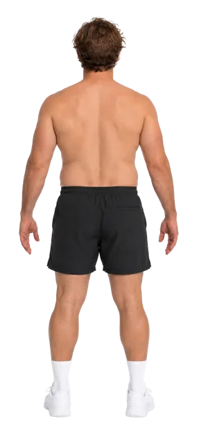 Latest Proof progress scan: back view of the same man in black shorts