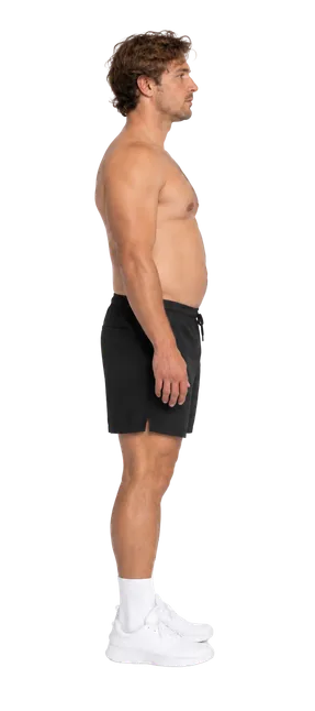 Latest Proof progress scan: side view of the same man in black shorts